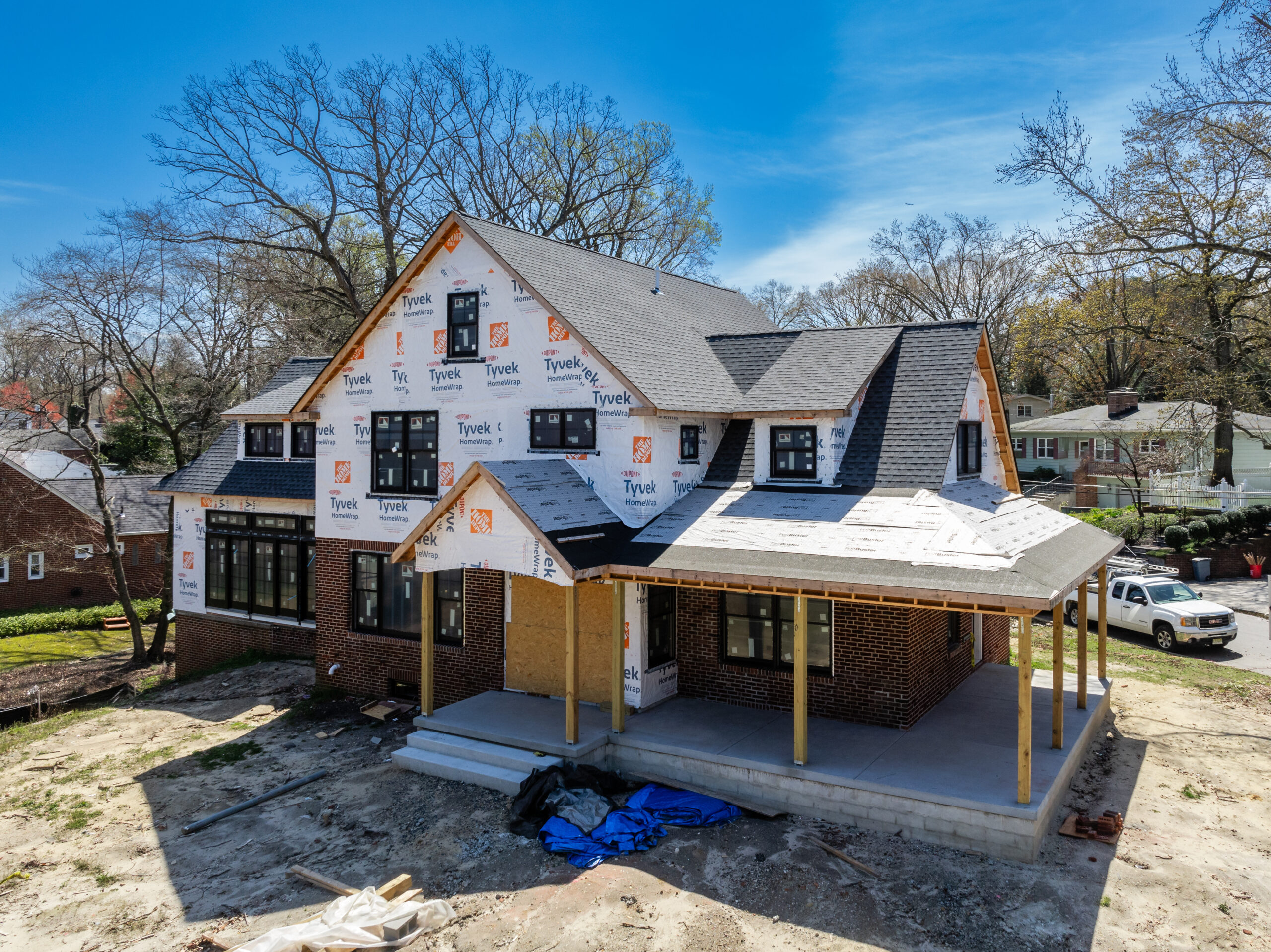 Professional team installing siding on a house in New Jersey.