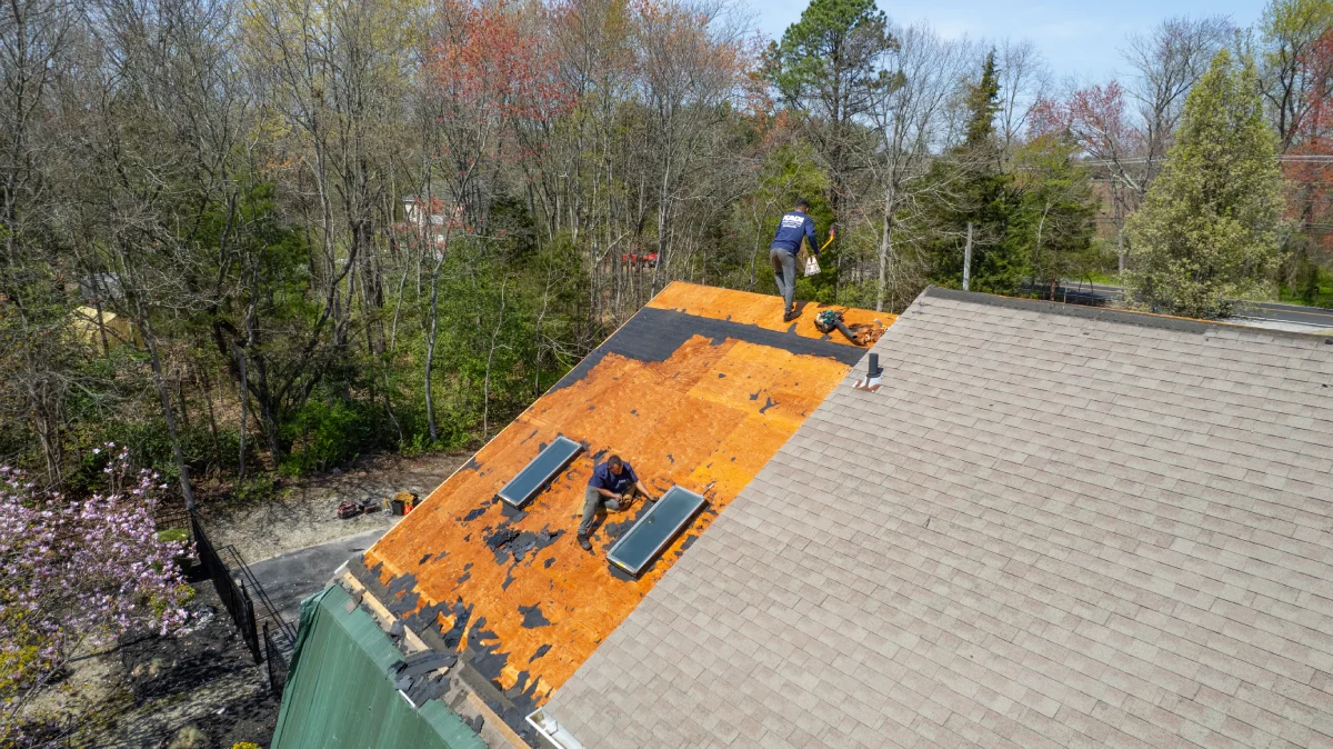 roofing-contractors-preparing-wood-decking-for-new-shingle-installation-in-hammonton-nj.