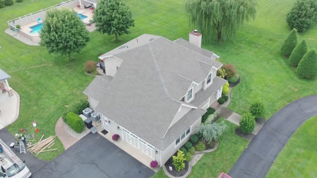 Aerial view of worn grey shingle roof before GAF roof replacement in Hammonton, NJ, with in-ground pool visible