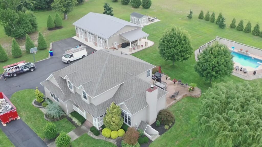 Aerial view of finished GAF roof replacement in Hammonton, NJ with pool and patio visible